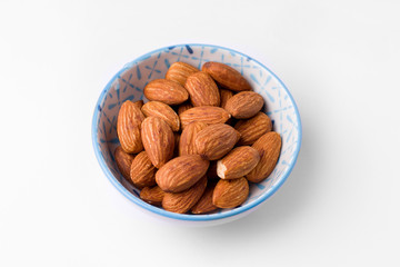 almonds in a bowl on a white background