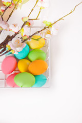 Colorful eggs for Easter day in a basket.