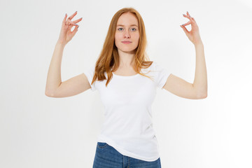 Red hair teen lady in zen pose poratrait on light background, practicing yoga and meditation, holding palms together in zen mudra looking calm relaxed and peaceful