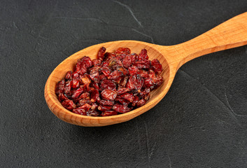 Dry barberry in spoon