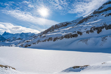 Winter landscape on the First mountain in Swiss Alps in Grindelwald ski resort, Switzerland