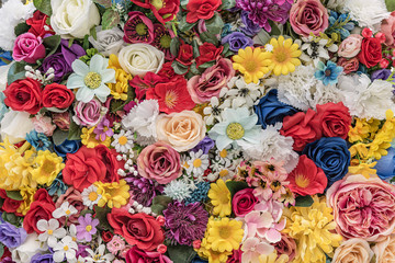 Artificial silk colored flowers. Bunch of vintage flowers