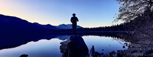 Panoramic view of a lake with person at the middle