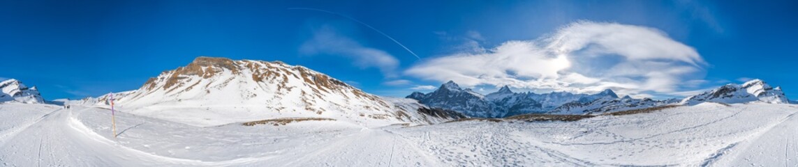 360 degree wide parnoramic view of snow covered Swiss Alps from First mountain in Grindelwald ski resort, Switzerland