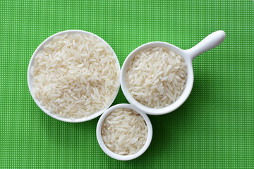 Natural raw white rice grains, on display in bowl