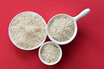 Natural raw white rice grains, on display in bowl