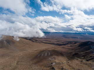 drone view of mojave desert hills with a cloudy sky