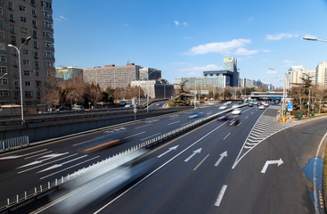 Chinese multi-lane highway at Beijing buildings 