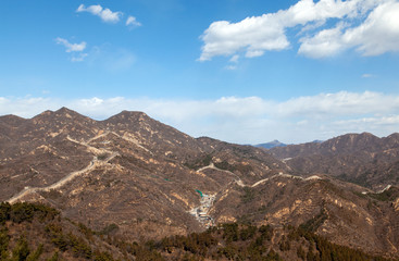 Famous Chinese Great Wall silhouette on brown hill 