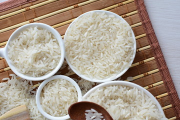 Natural raw white rice grains, on display in bowl