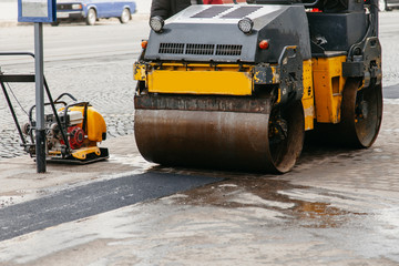 car tamps asphalt on the sidewalk in the city