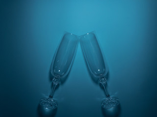 Two glasses to meet each other on a turquoise background.Festive romantic concept.