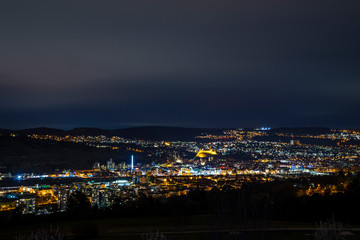 Germany, Magical night lights of medieval city esslingen am neckar near stuttgart, illuminated by night, aerial view above houses and skyline