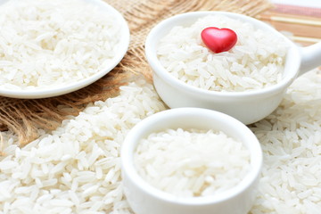 Natural raw white rice grains, on display in bowl