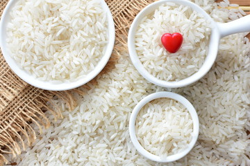 Natural raw white rice grains, on display in bowl