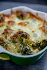 Fresh baked brocolli and cheese. Tasty food, detail, close up. 