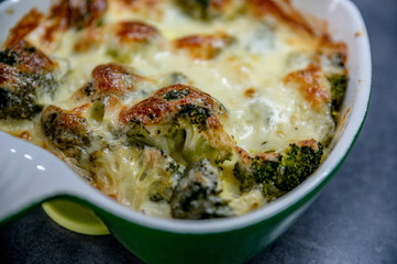 Fresh baked brocolli and cheese. Tasty food, detail, close up. 