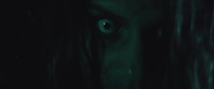 Terrifying creepy zombie woman with white eyes and scary look. Horror style shot