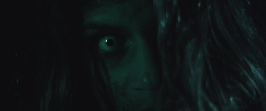 Terrifying creepy zombie woman with white eyes and scary look. Horror style shot