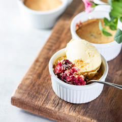 Crumble with cherry with vanilla ice cream.
