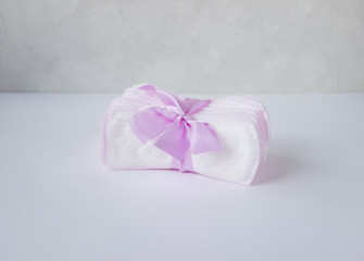 Fototapeta na wymiar women's sanitary daily pads lie on a light background, a menstrual concept, hygienic minimalism