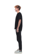 side view. a young man in a black t-shirt.