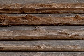 Naklejka premium Texture od wooden planks. Wall made of antique wood. Raw wood after century.