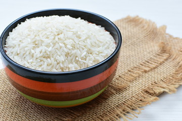 Natural raw white rice grains, on display in bowl