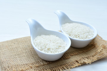 Natural raw white rice grains, on display in bowl