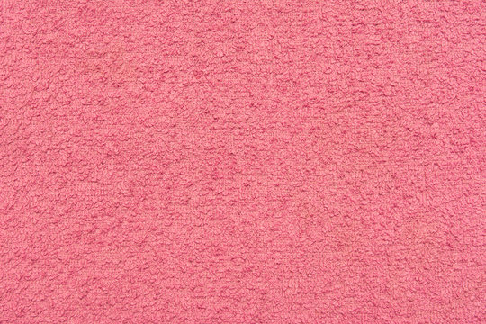 The texture of a pink wool towel.