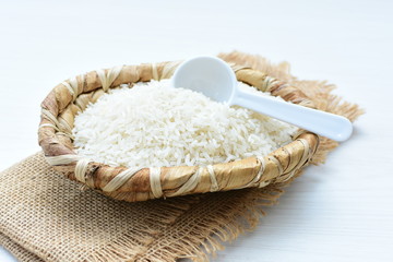 Natural raw white rice grains, on display in bowl