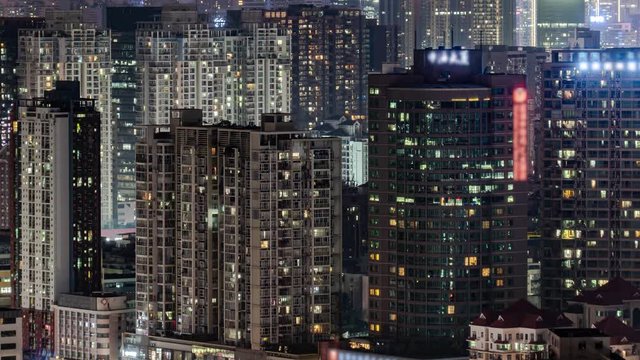 Day To Night Timelapse Of Downtown Apartment Buildings. Chinese Crowded City Overnight. Fast Paced Modern Asian Night-scape Time Lapse In Urban Metropolis Of Shenzhen.