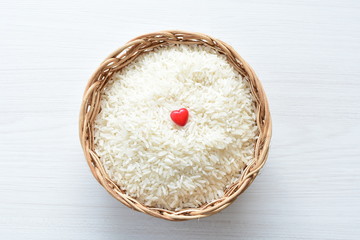Natural raw white rice grains, on display in bowl
