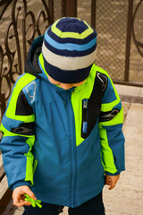  A small child plays a fidget spinner. Toy antistress