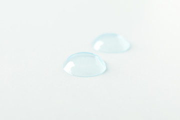 Contact lenses on white background, close up