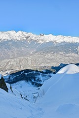 top view of a high mountain gorge with snowy ridges