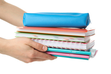 Female hands hold copybooks, isolated on white background