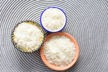 Natural raw white rice grains, on display in bowl