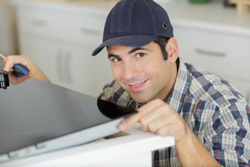 man installing kitchen - diy concept