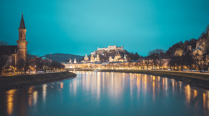 Fototapeta na wymiar Salzburg old city at dusk: Salzach, fortress Hohensalzburg and Cathedral