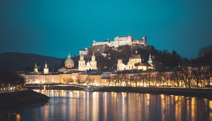 Naklejka premium Salzburg old city at dusk: Salzach, fortress Hohensalzburg and Cathedral
