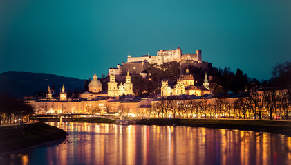 Salzburg old city at dusk: Salzach, fortress Hohensalzburg and Cathedral