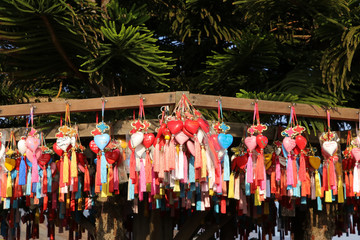 Mae Hong Son Province, Thailand - Jan 1, 2020: Colorful heart shaped key rings hanging around a tree as a souvenir to visit. Yon Lai Viewpoint
