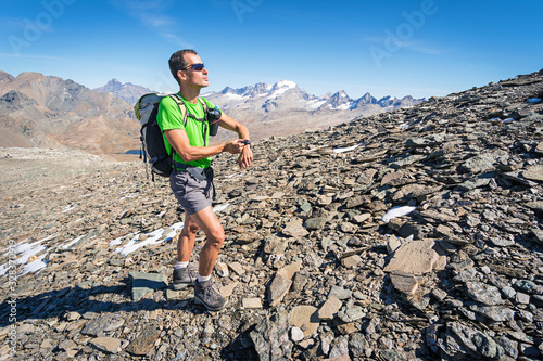 Man trekking in the Alps in a beautiful sunny day. Grand Paradiso National   Park. Italy