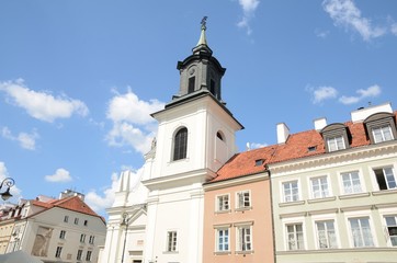 Fototapeta na wymiar Church among buildings in Warsaw, Poland