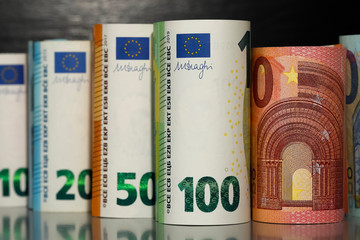 There are rolled-up Euro banknotes