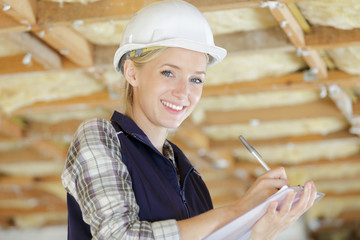 portrait of young beautiful designer in a construction site © auremar