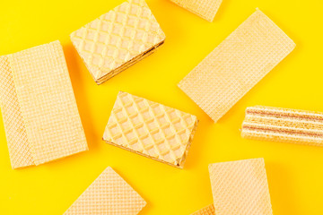 Crispy waffle sticks on a yellow background