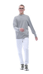 in full growth. smiling youngster in glasses goes forward