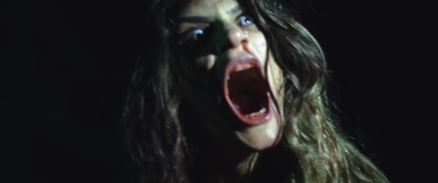 Zombie woman with white eyes screaming, looking scary and terrifying. BMPCC 4K